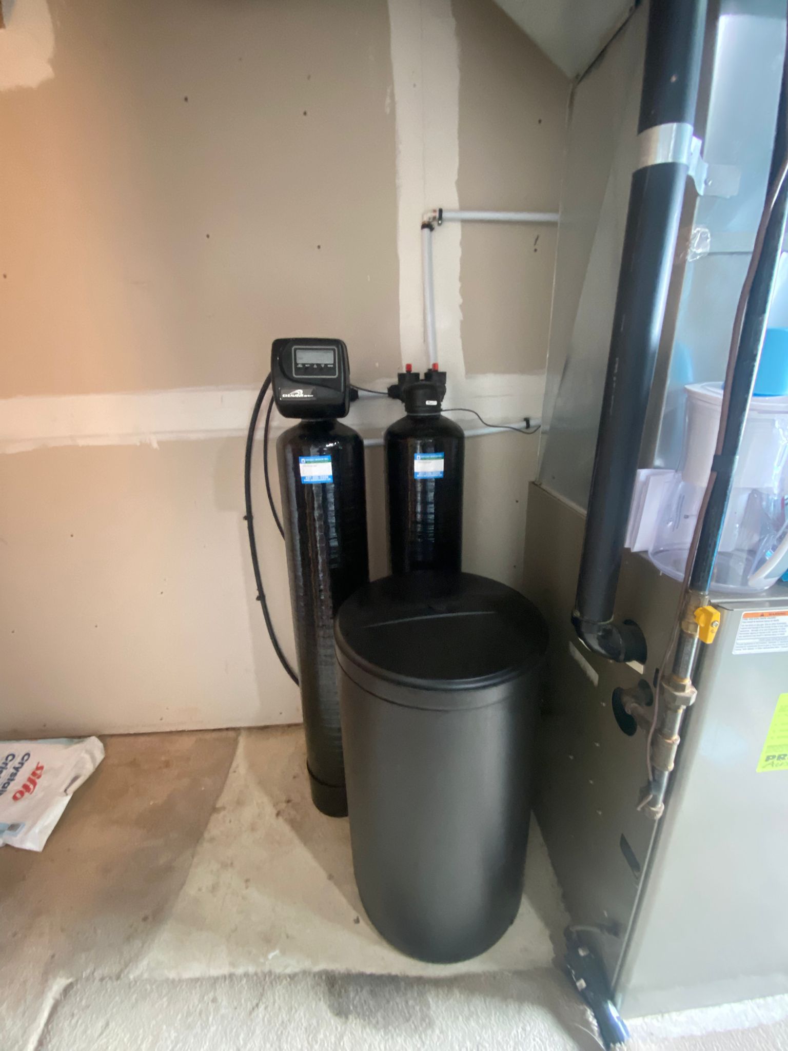 Water treatment technician installing system
